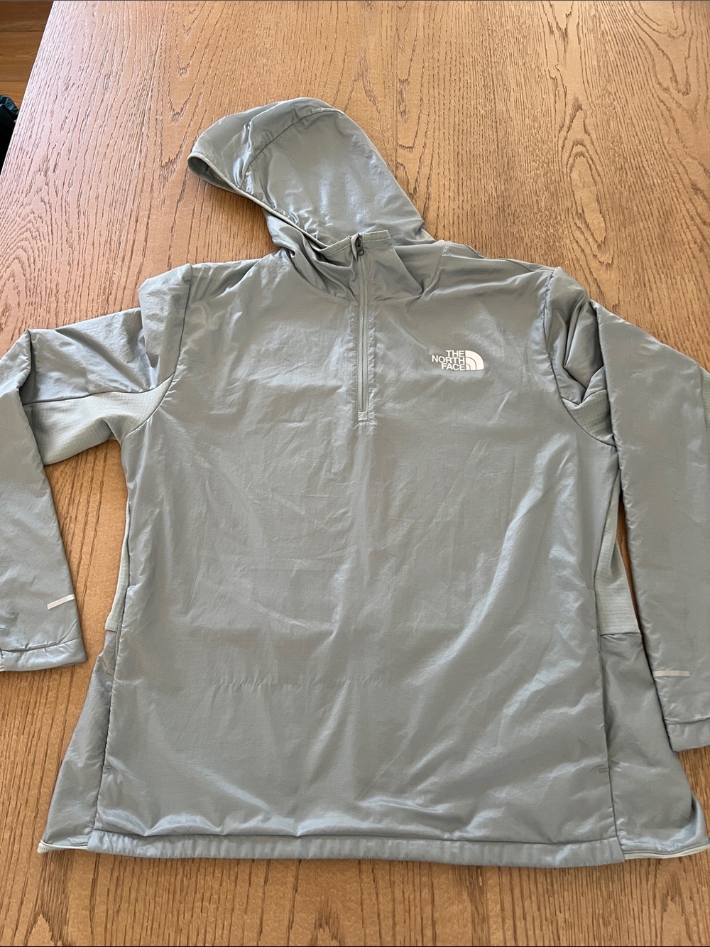 The North Face 1/4 Zip Women’s  Hooded Windbreaker in sea foam color